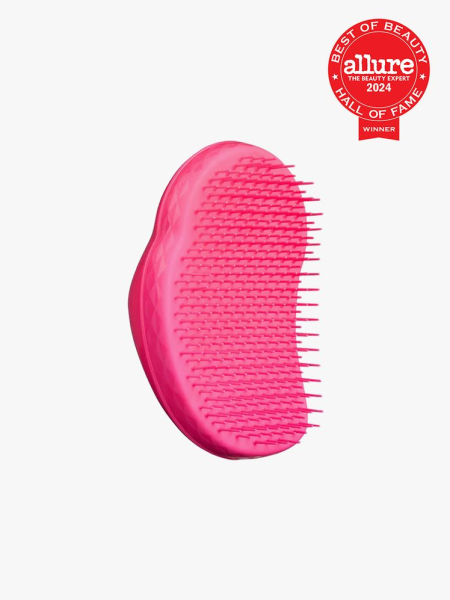 Tangle Teezer The Original hot pink hair brush on light gray background with red Allure Best of Beauty Hall of Fame seal in the top right corner